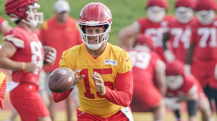 Patrick Mahomes takes a snap during training camp